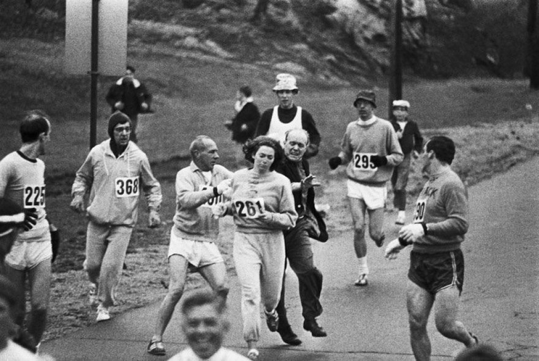 Race organizers attempting to stop Kathrine Switzer from competing in the Boston Marathon. She became the first woman to finish the race