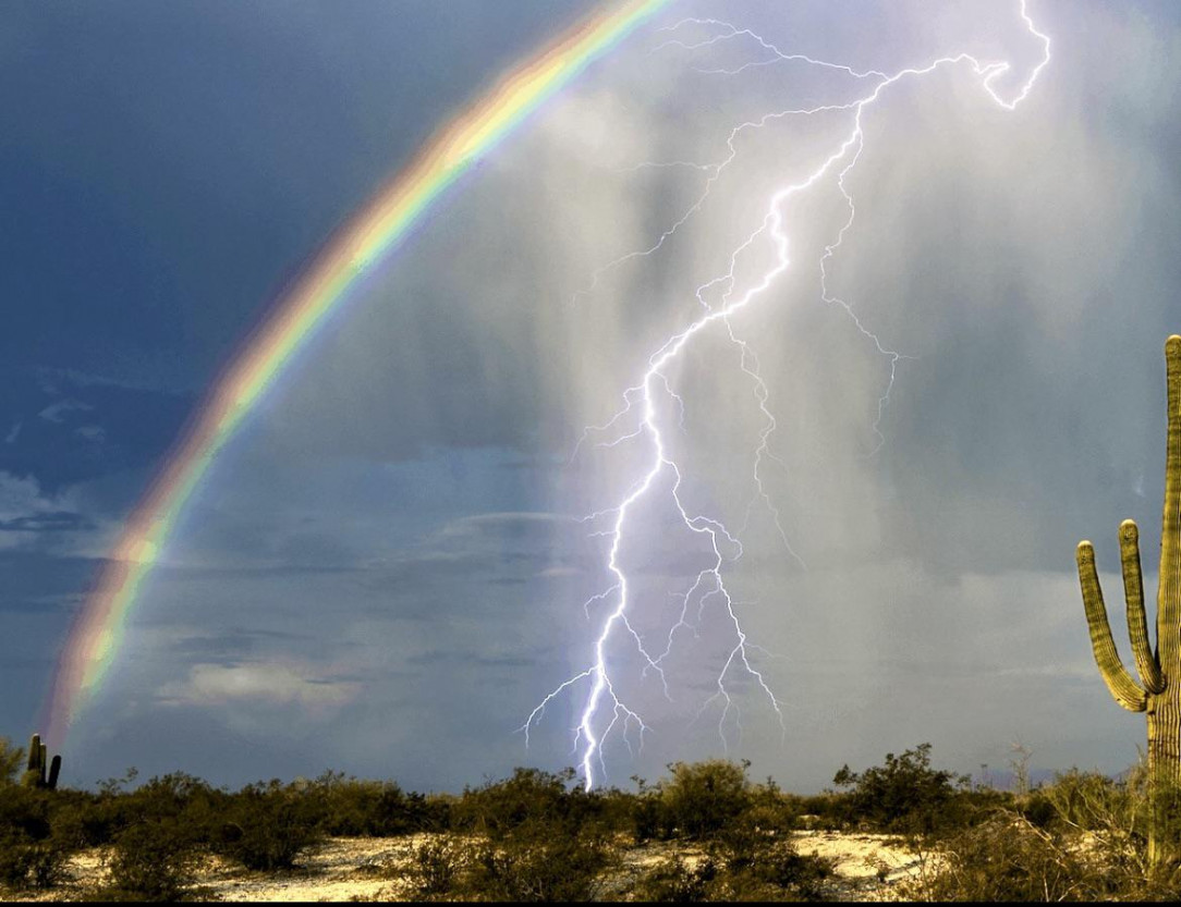 Rainbows and lightning are both beautiful specially when caught on camera together