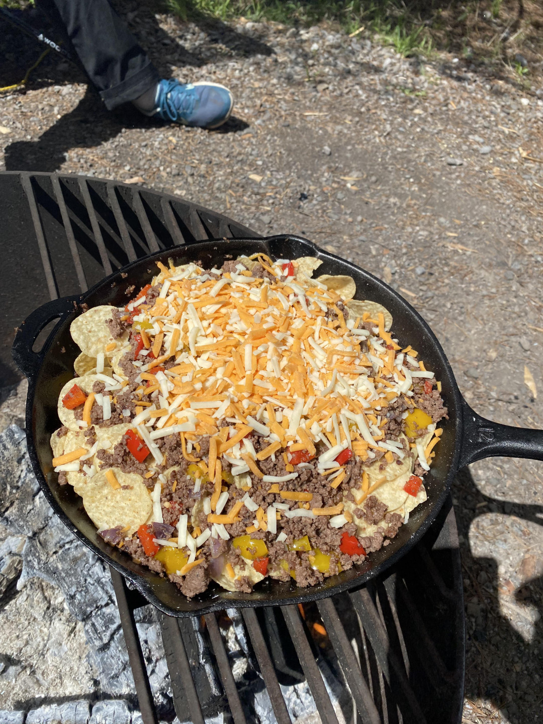 Castiron nachos over the fire while camping