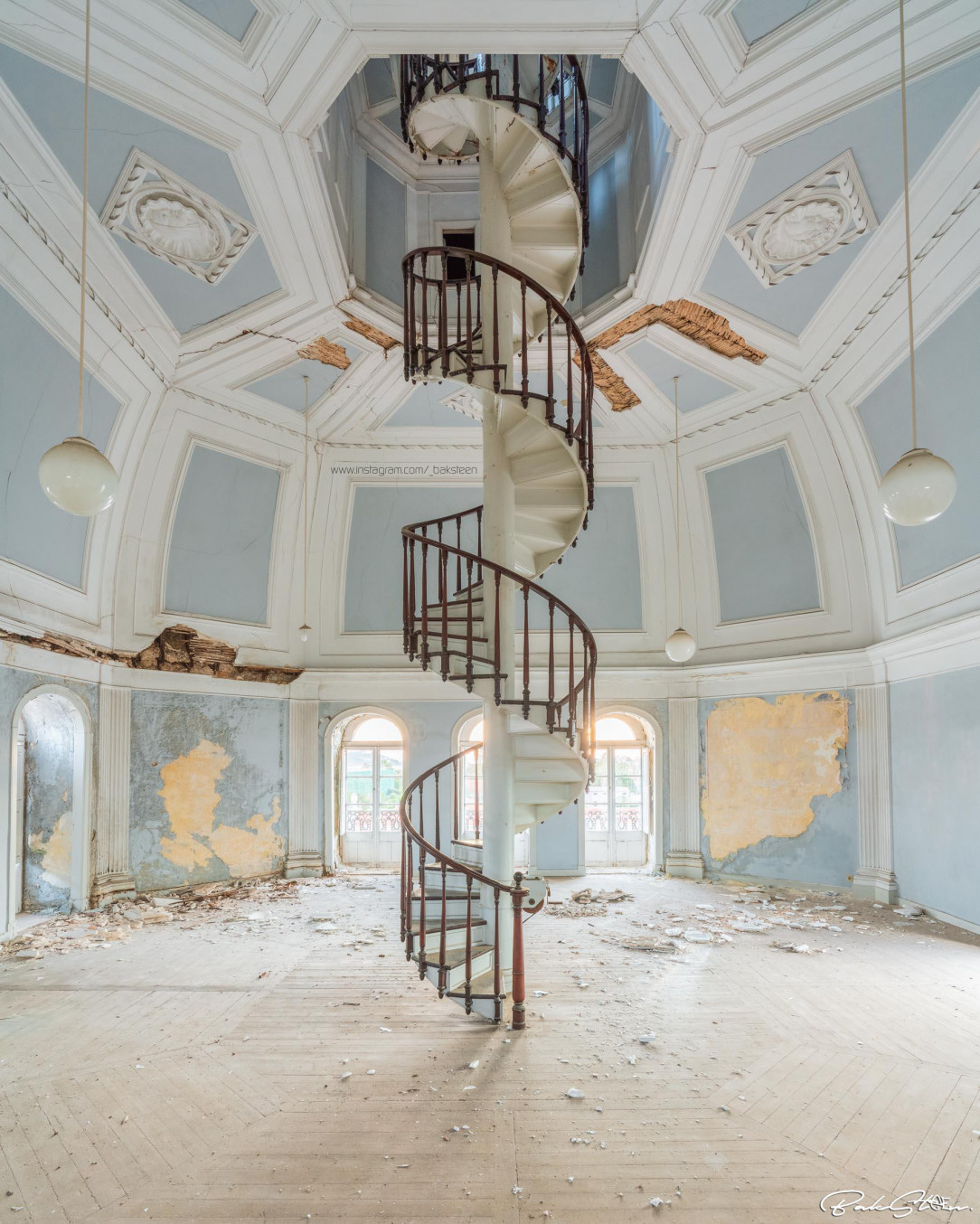 Spiral staircase to the attic of an abandoned school