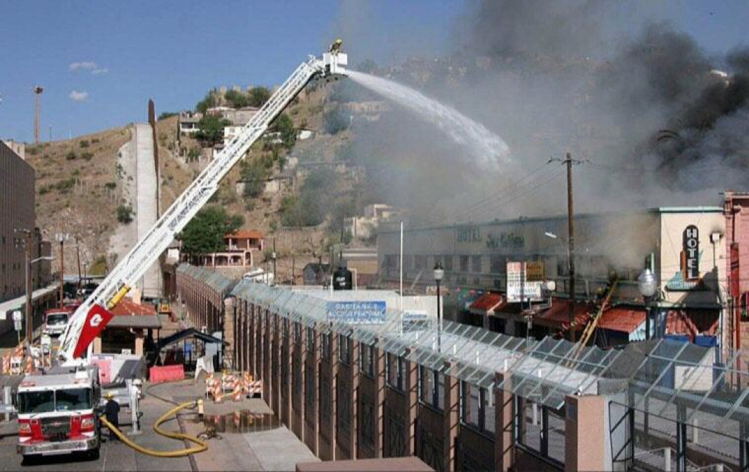 Arizona firmen putting out a Mexican fire