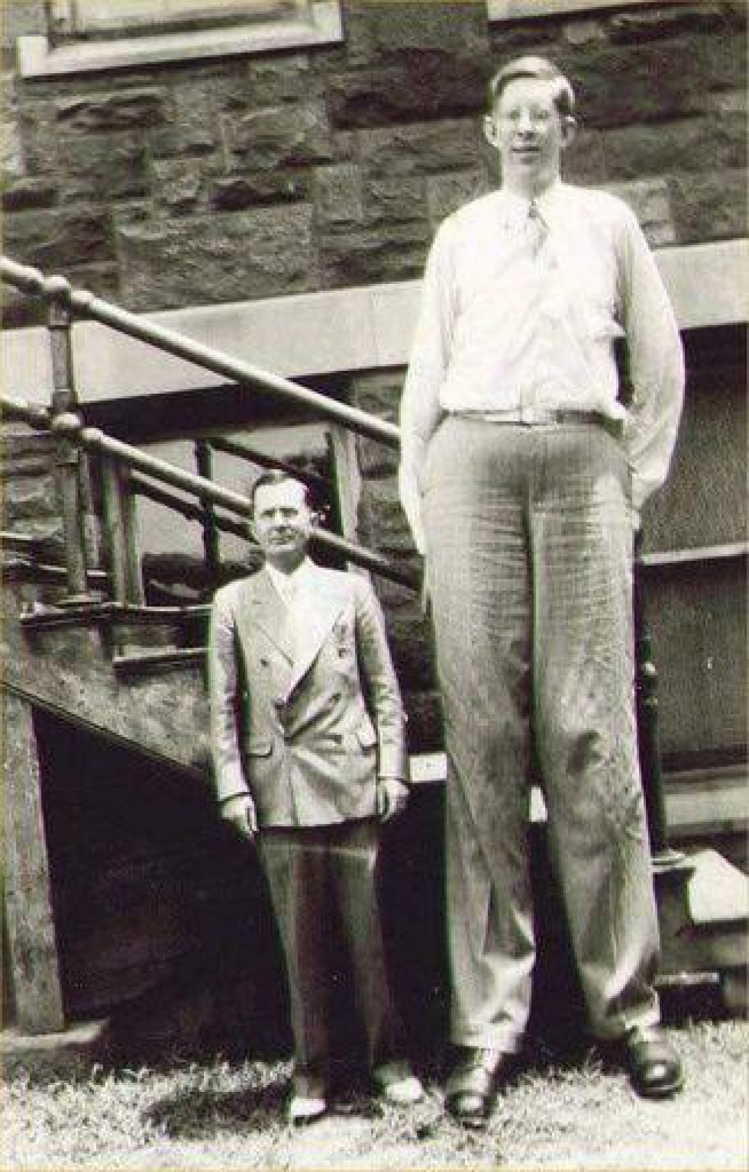 Robert Wadlow (8’11) standing next to his father (5’11)
