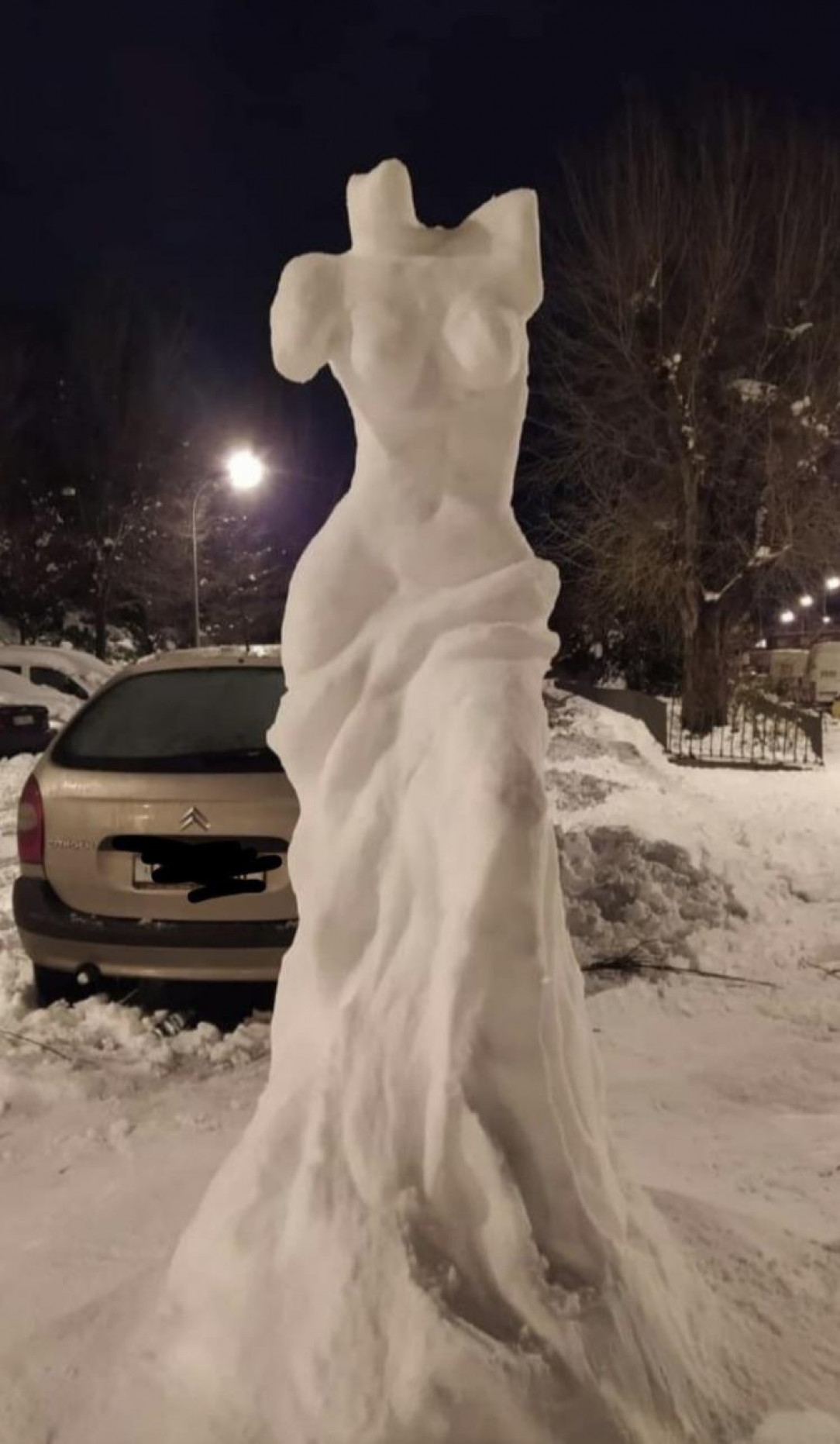 This snow sculpture of a woman’s body