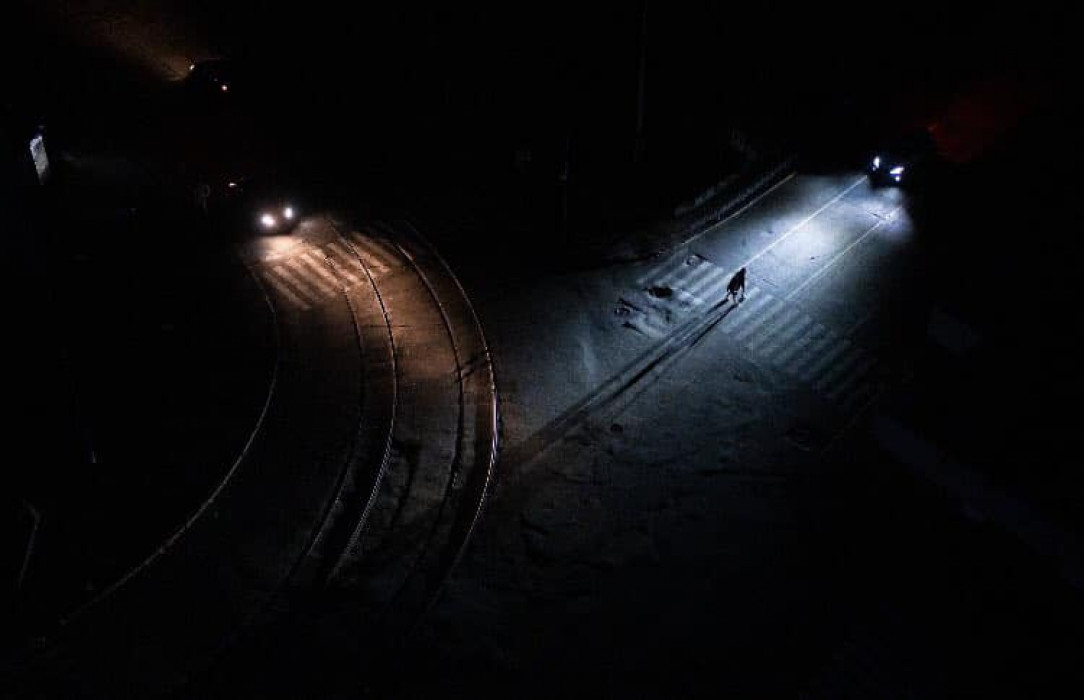 Kyiv person crossing the street in the evening. Im romanian but if they can go through this we can all do it