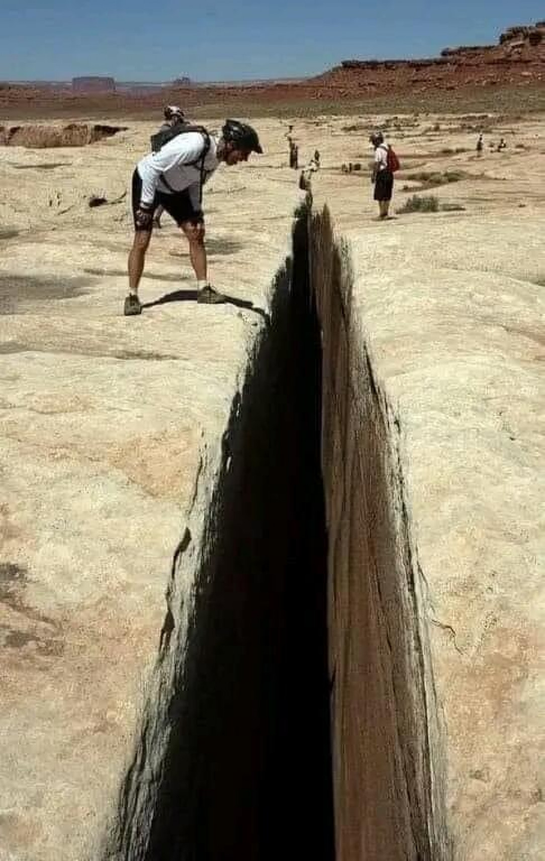 Black crack, a 65 foot deep fissure along a trail in Canyonlands national park, Utah