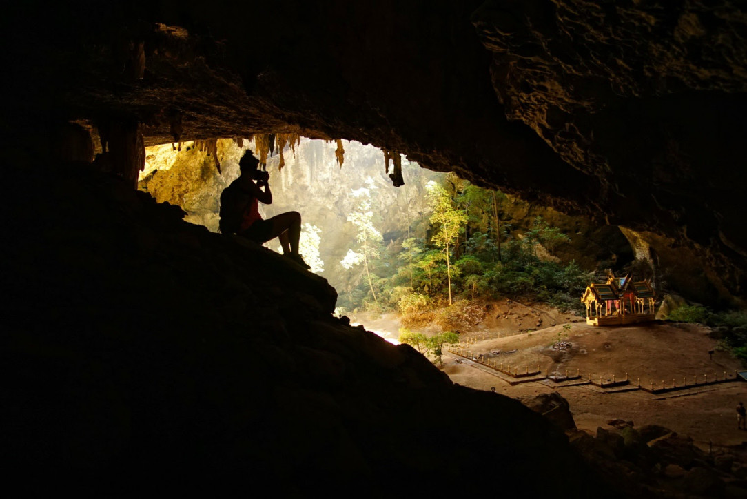 A picture of the Photographer taking a picture of the Temple in a cave in Thailand