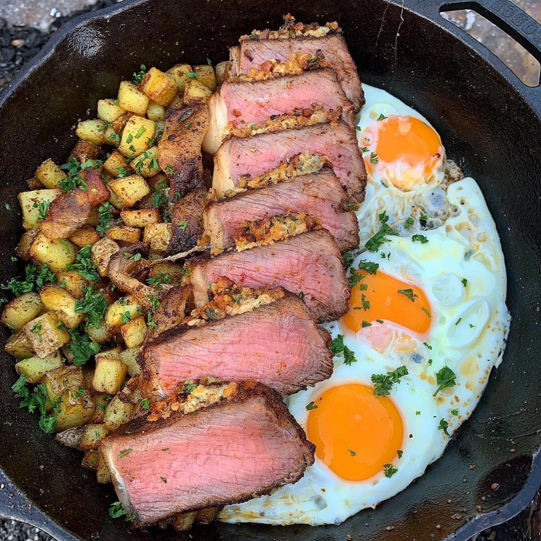 Camping steak and eggs in a cast iron pan