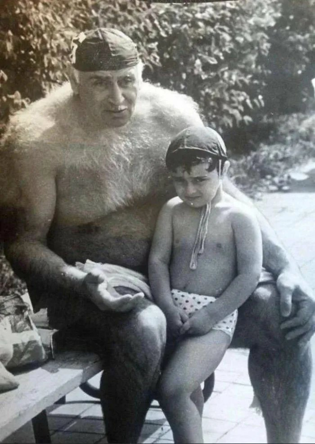 Soviet-georgian water polo player Petre Kako Mshvenieradze with his grandson. 1990s