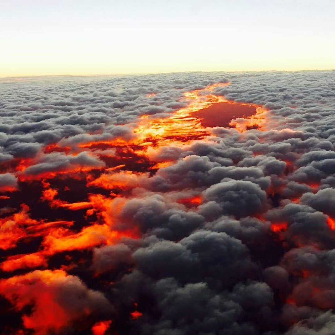 This sunset over clouds in Australia look like a burning landscape
