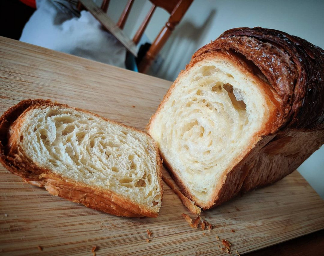 A croissant the size of a loaf of bread/a loaf made of croissant dough