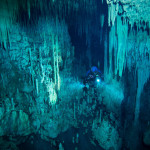 An underwater cave in Mexico, displaying its jagged stalagmites and stalactites